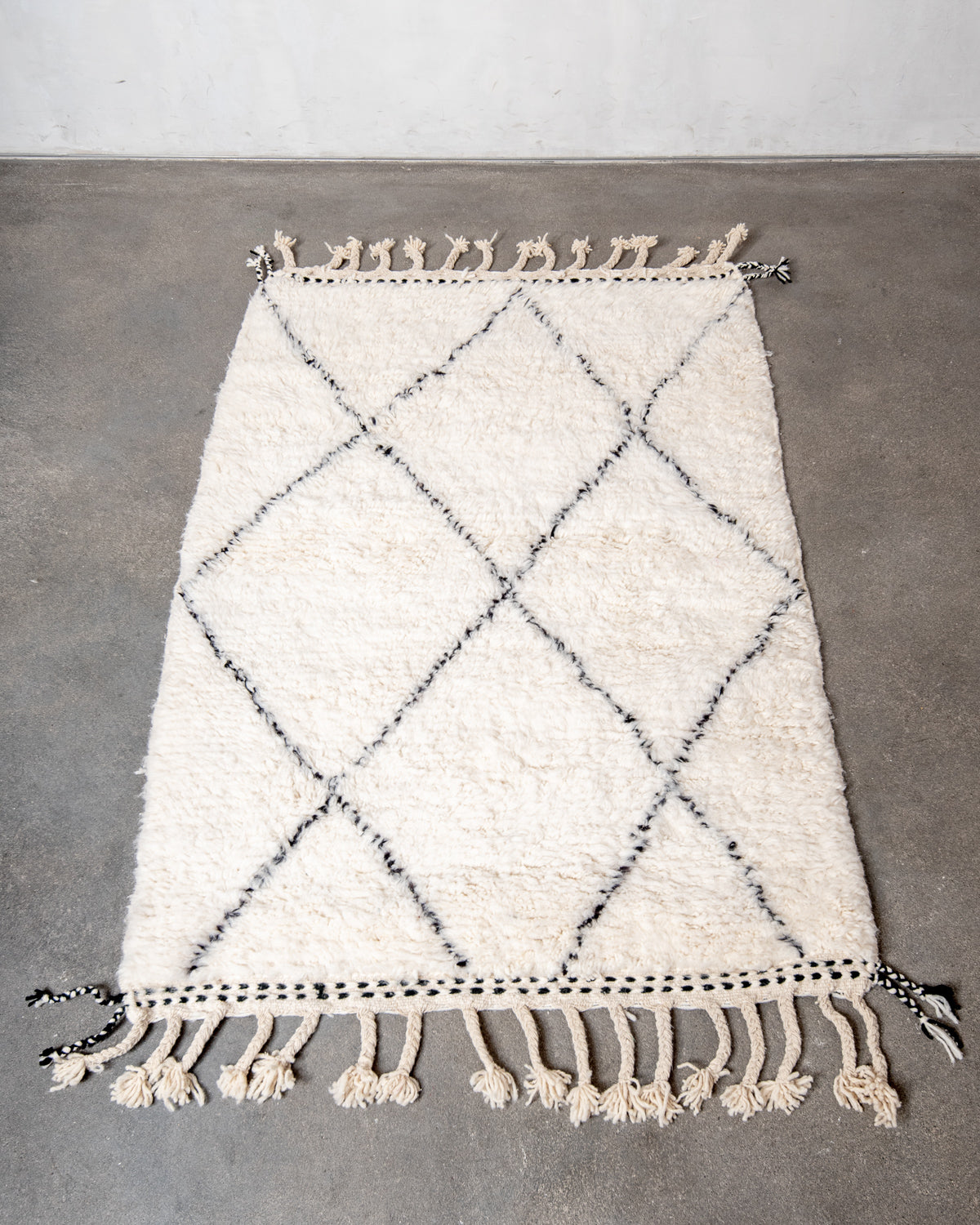 Modern, designer, handcrafted Berber rug from Morocco. Beniourain carpet with minimalist design, natural wool pile and a fluffy texture.